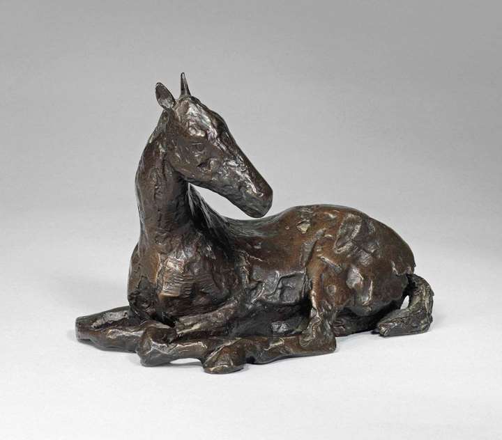 Small sitting down horse